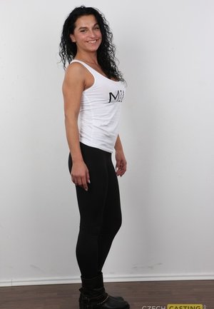 1 dark haired female tortures another during lezdom play in concrete cellar